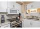 Functional kitchen with white cabinets, stainless steel appliances, and granite countertops at 400 20Th Ave. N # 101, Myrtle Beach, SC 29577