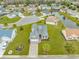 Aerial view of a home with a two-car garage, green lawn, and cul-de-sac street at 401 Oak Crest Circle, Longs, SC 29568