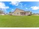 Expansive backyard featuring lush green grass and the home's exterior at 401 Oak Crest Circle, Longs, SC 29568