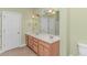 Bathroom showcasing a double sink vanity, large mirror, and ample lighting at 401 Oak Crest Circle, Longs, SC 29568