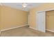 Bedroom featuring neutral walls, carpet, a ceiling fan, and a closet at 401 Oak Crest Circle, Longs, SC 29568