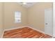 Bedroom featuring hardwood floors, neutral walls, and a window at 401 Oak Crest Circle, Longs, SC 29568