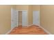 Spacious bedroom features a hardwood floor, closet, and neutral-colored walls at 401 Oak Crest Circle, Longs, SC 29568