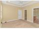 Bedroom featuring neutral walls, carpet, a ceiling fan, and a view into the ensuite bathroom and closet at 401 Oak Crest Circle, Longs, SC 29568