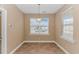 Inviting dining nook boasts natural light and seamless transition to the kitchen and other living areas at 401 Oak Crest Circle, Longs, SC 29568