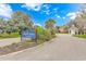 Community entrance sign for Myrtle Lakes North under a sunny, blue sky at 401 Oak Crest Circle, Longs, SC 29568