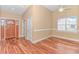 Open living area featuring hardwood floors, and a window that allows in natural light at 401 Oak Crest Circle, Longs, SC 29568