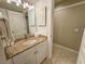 Bright bathroom featuring a granite countertop, and a doorway to another room at 410 Melrose Pl. # 304, Myrtle Beach, SC 29572