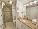 Bathroom featuring a granite countertop, with a glass shower and a door at 410 Melrose Pl. # 304, Myrtle Beach, SC 29572