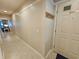 Hallway view including tile flooring, the front door, and a coat rack at 410 Melrose Pl. # 304, Myrtle Beach, SC 29572