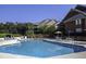 Community pool with lots of chairs and tables for residents to enjoy at 410 Melrose Pl. # 304, Myrtle Beach, SC 29572