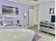 Cozy bedroom featuring light purple walls, a plush bed, and modern furnishings at 415 28Th Ave. N # 4-A, Myrtle Beach, SC 29577