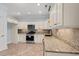 Kitchen featuring white cabinets, stainless appliances and granite countertops at 425 Retriever Ct., Murrells Inlet, SC 29576