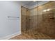 Tiled walk-in shower with glass door and bronze fixtures at 425 Retriever Ct., Murrells Inlet, SC 29576