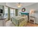 Bright bedroom featuring a sliding glass door to an ocean view balcony at 4301 S Ocean Blvd. # 7A, North Myrtle Beach, SC 29582