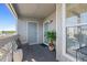 Relaxing balcony with gray textured carpet, exterior entrance, and a lovely view at 4396 Baldwin Ave. # 19, Little River, SC 29566