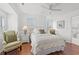 Bright bedroom with natural light, ceiling fan, and ensuite bathroom at 4396 Baldwin Ave. # 19, Little River, SC 29566