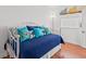 Bedroom with a daybed with blue patterned pillows and hardwood floors at 4396 Baldwin Ave. # 19, Little River, SC 29566