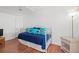 Bedroom with a daybed with blue patterned pillows and hardwood floors at 4396 Baldwin Ave. # 19, Little River, SC 29566