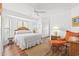 Inviting bedroom with natural light, ceiling fan, and woven headboard at 4396 Baldwin Ave. # 19, Little River, SC 29566