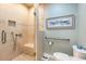 Accessible bathroom with a step-in shower, a seat, and a grab bar next to the toilet at 4413 Bed Straw Ct., Murrells Inlet, SC 29576