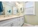 Bathroom featuring double sinks, vanity, ample lighting, and neutral paint at 4413 Bed Straw Ct., Murrells Inlet, SC 29576