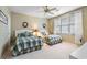 Bright bedroom featuring twin beds with patterned bedding and large windows offering plenty of natural light at 4413 Bed Straw Ct., Murrells Inlet, SC 29576