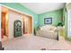 Cozy bedroom with green walls and bright sunlight at 4413 Bed Straw Ct., Murrells Inlet, SC 29576