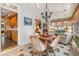 Bright dining area featuring a chandelier, hardwood table, and views into the living area and kitchen at 4413 Bed Straw Ct., Murrells Inlet, SC 29576