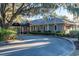 Attractive building with a covered entrance, manicured landscaping, and a welcoming driveway at 4413 Bed Straw Ct., Murrells Inlet, SC 29576