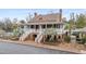 Grand two-story home with brick facade, double staircase and mature landscaping at 4413 Bed Straw Ct., Murrells Inlet, SC 29576