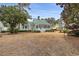 Charming home with a green metal roof, inviting porch, and beautifully landscaped yard at 4413 Bed Straw Ct., Murrells Inlet, SC 29576