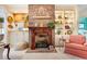 Close-up of a detailed brick fireplace with decorative mantle and built-in display cabinets at 4413 Bed Straw Ct., Murrells Inlet, SC 29576