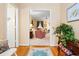 Inviting foyer leading into a spacious living room with hardwood floors and stylish decor at 4413 Bed Straw Ct., Murrells Inlet, SC 29576