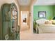 Hallway leading into a cozy bedroom, decorated with a wicker shelf at 4413 Bed Straw Ct., Murrells Inlet, SC 29576