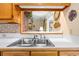 Stainless steel double sink with a view to an informal living area at 4413 Bed Straw Ct., Murrells Inlet, SC 29576