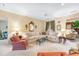 Bright living room with plush seating and a view into an adjacent room with bay windows at 4413 Bed Straw Ct., Murrells Inlet, SC 29576