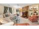 Cozy living room featuring a brick fireplace and built-in display shelves at 4413 Bed Straw Ct., Murrells Inlet, SC 29576