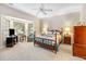 Traditional main bedroom with a ceiling fan, bay window, and comfortable furniture at 4413 Bed Straw Ct., Murrells Inlet, SC 29576