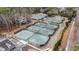 Overhead view of multiple pristine tennis courts in a residential community at 4413 Bed Straw Ct., Murrells Inlet, SC 29576