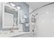Well-lit bathroom with a white vanity, a toilet, and a shower and tub combination at 4502 Little River Inn Ln. # 2507, Little River, SC 29566