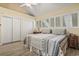 Bedroom featuring white plantation shutters, closet, and ceiling fan at 4502 Little River Inn Ln. # 2507, Little River, SC 29566