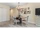 Dining room featuring hardwood floors, charming chandelier, and stylish decor, creating an elegant and inviting space for meals at 4502 Little River Inn Ln. # 2507, Little River, SC 29566
