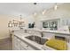 Open kitchen with a breakfast bar overlooking the dining area, with views to the outdoor patio, ideal for entertaining at 4502 Little River Inn Ln. # 2507, Little River, SC 29566
