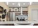 Bright kitchen featuring stainless steel appliances, custom shelving, and a stylish range hood, perfect for culinary enthusiasts at 4502 Little River Inn Ln. # 2507, Little River, SC 29566