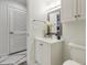 Elegant bathroom with a white vanity, framed mirror, and a tiled floor at 4515 Lighthouse Dr. # 25B, Little River, SC 29566