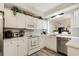 Bright kitchen with white cabinetry, modern appliances, and garden window at 4515 Lighthouse Dr. # 25B, Little River, SC 29566