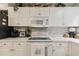 Well-lit kitchen with white cabinets, subway tile backsplash, and modern appliances at 4515 Lighthouse Dr. # 25B, Little River, SC 29566