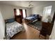 Inviting bedroom with nautical themed decor, ceiling fan and wood-look flooring at 4601 Lewis St., North Myrtle Beach, SC 29582