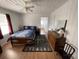 Bedroom with a nautical theme, ceiling fan, wood-look flooring and a lamp on the dresser at 4601 Lewis St., North Myrtle Beach, SC 29582